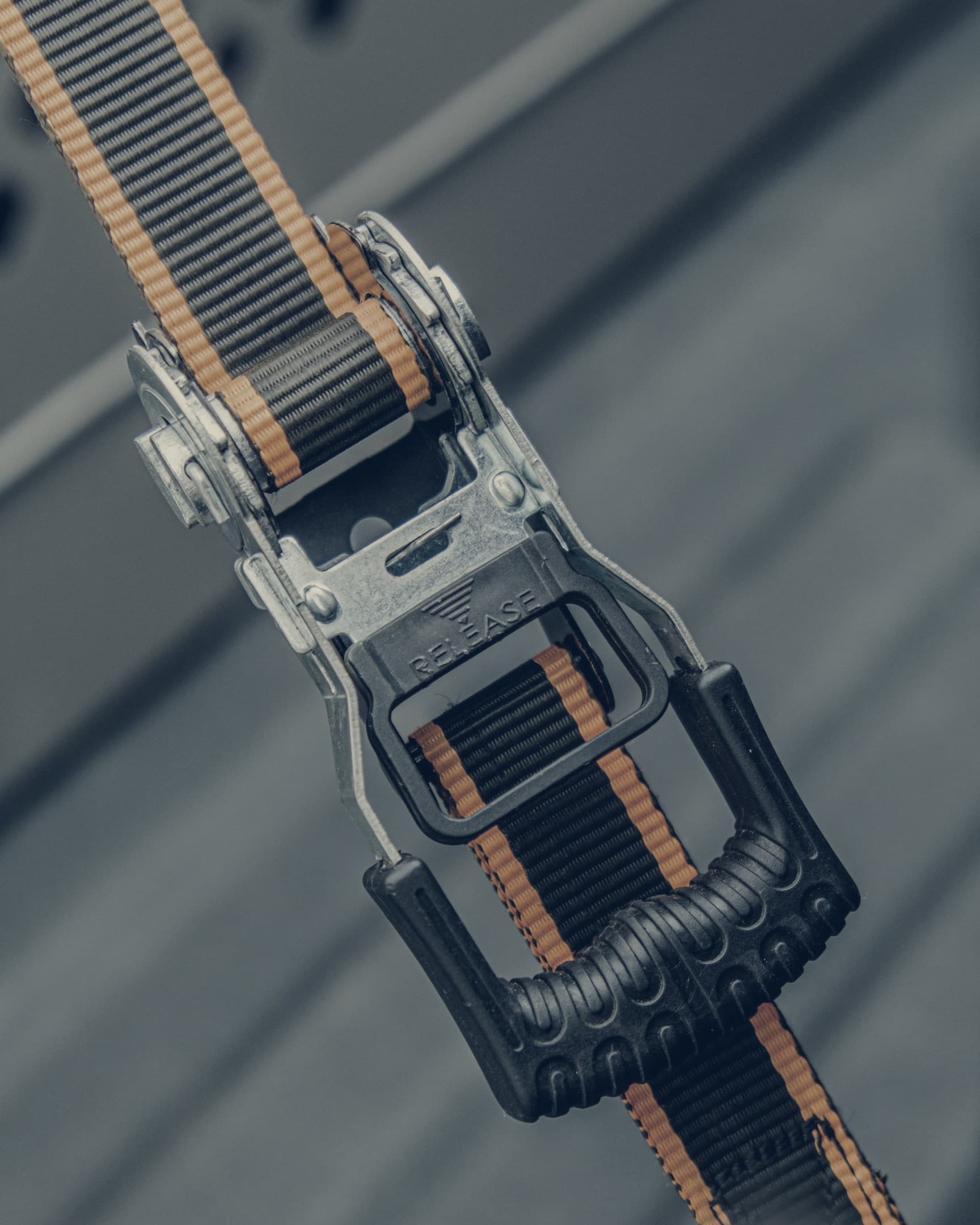 Close-up of curtain-side tensioning strap and buckle hardware