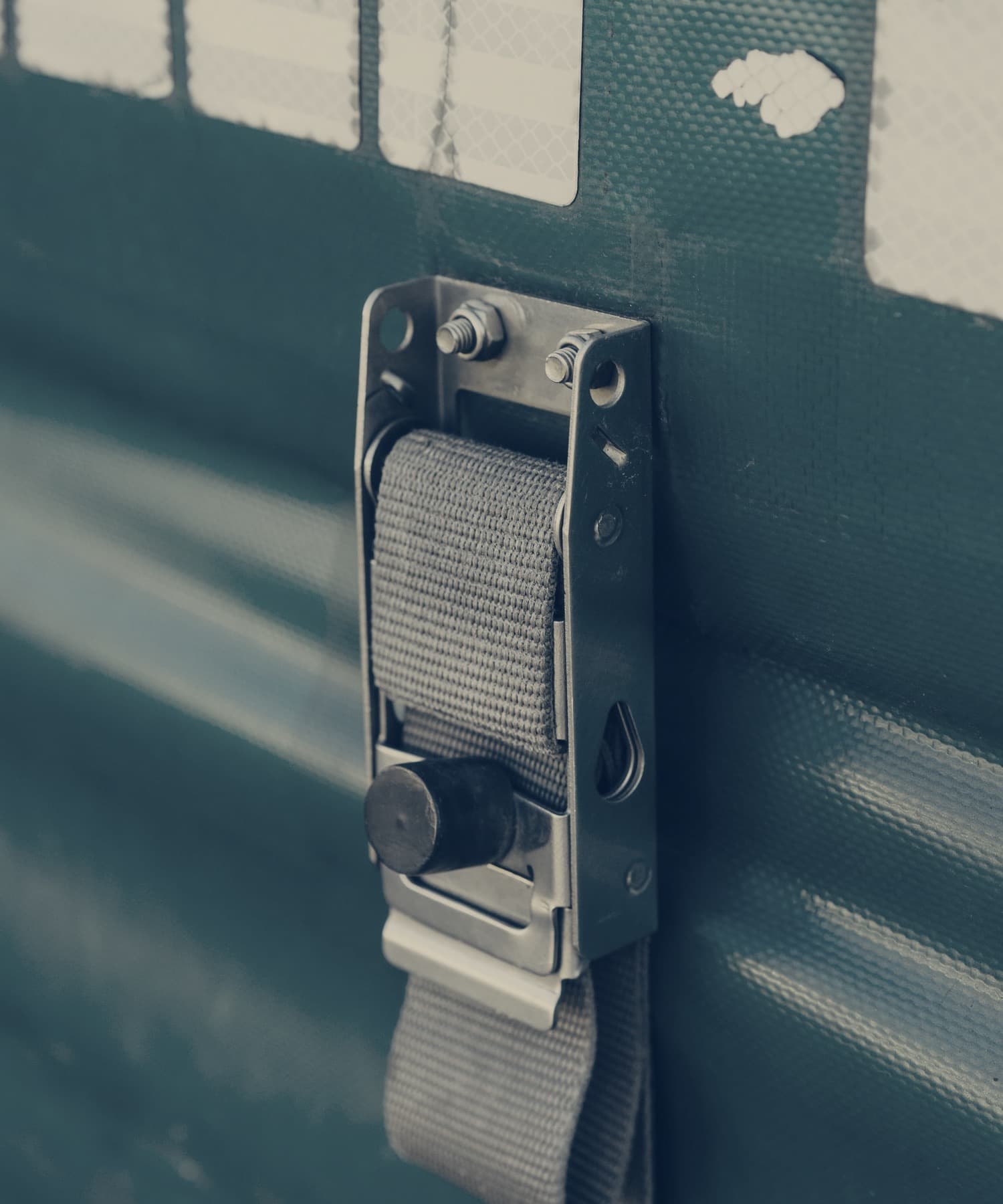 Close-up of a curtain-side trailer tensioning buckle